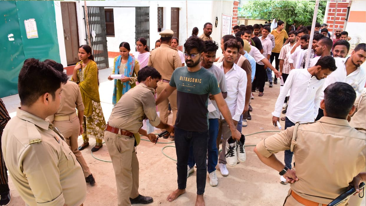 UP Police recruitment exam Impostor arrested after showing up to take test in place of his cousin in varanasi