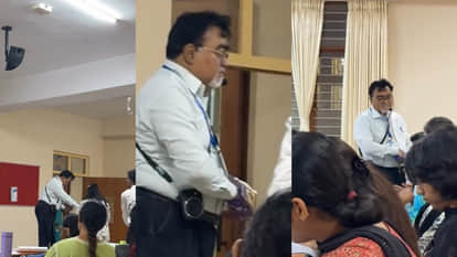 क्लासरूम के अंदर चॉकलेट बांटते प्रोफेसर
