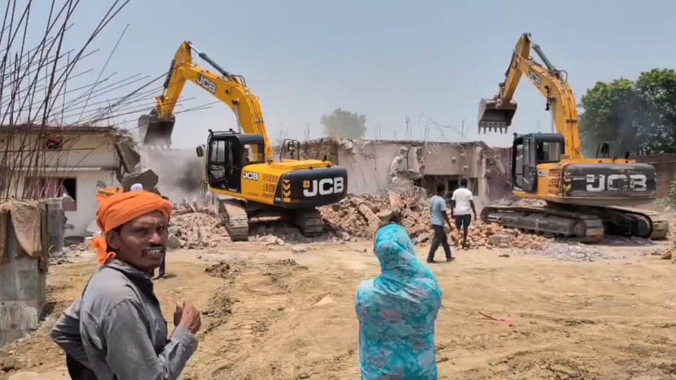 Two major actions by the district administration bulldozers razed illegal encroachments demolishing houses a