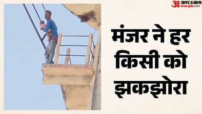 Young man climbs water tank with nine-month-old son after dispute with wife