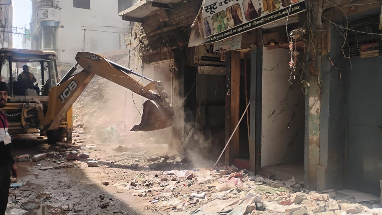 Dalmandi Widening varanasi Bulldozer action on 12 building work to remove 100 trolley-loads of debris underway