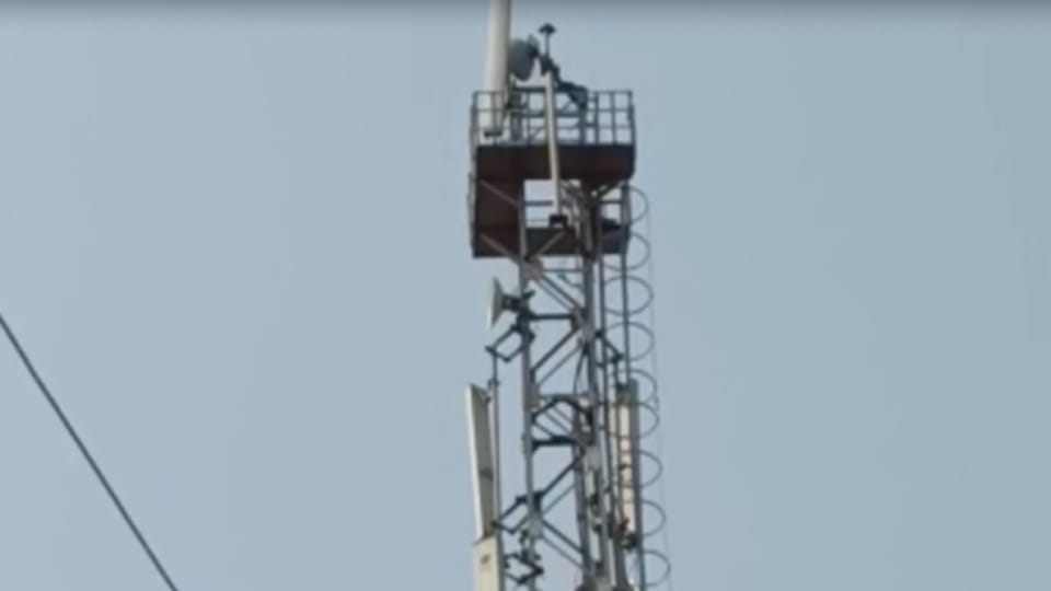 man climbs mobile tower after being harassed by Haryana Police demands CBI involvement