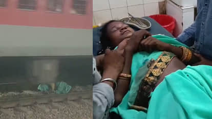 Woman falls between railway tracks after slipping; train passes over her, she narrowly survives