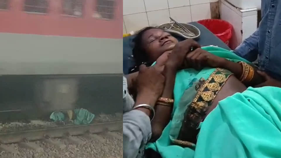 Woman falls between railway tracks after slipping; train passes over her, she narrowly survives