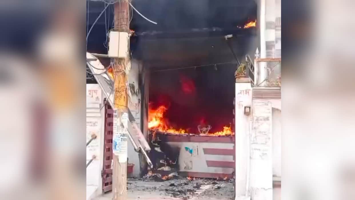 Massive fire breaks out at a stationery shop in Lukerganj; four people, including two children, rescued.