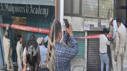 एनटी अकादमी और कोचिंग सेंटर को सील करते अधिकारी