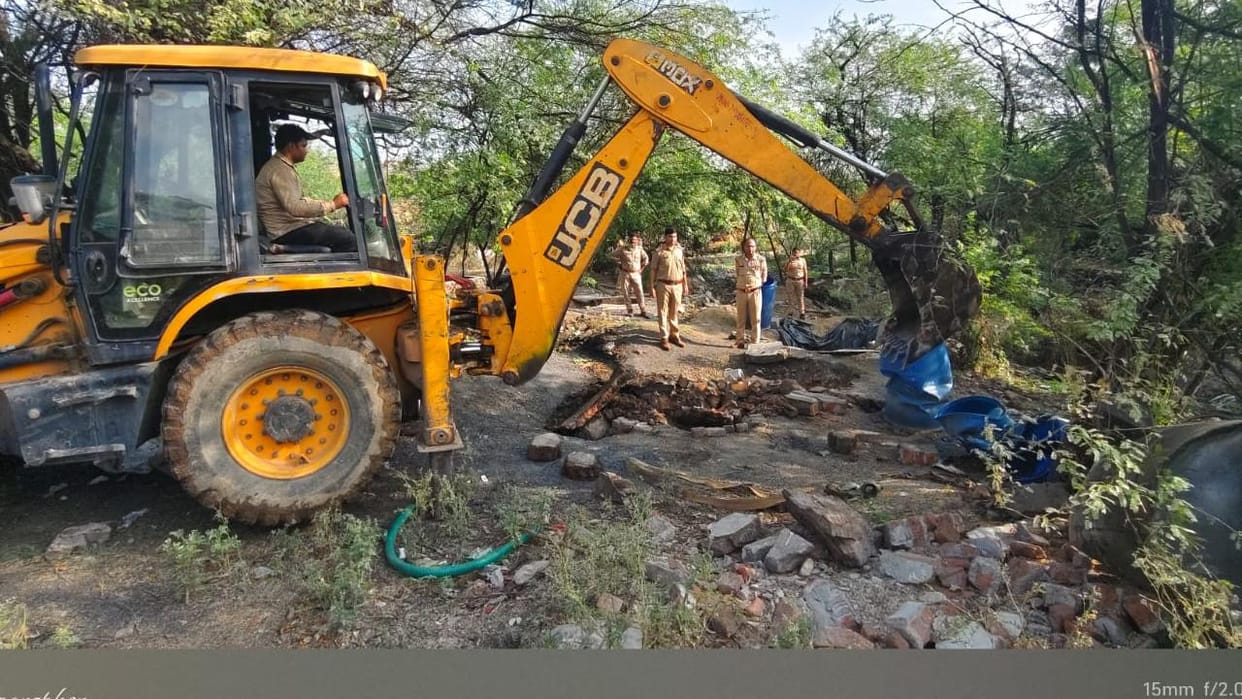 Jhansi: Police used a JCB to demolish vats and drums used for making illicit liquor
