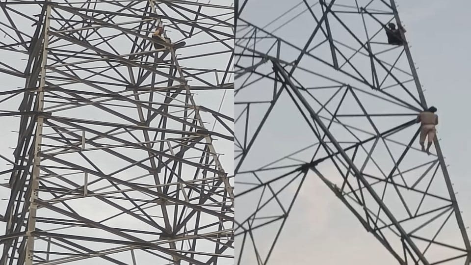 Man climbs high-tension line tower after dispute with wife