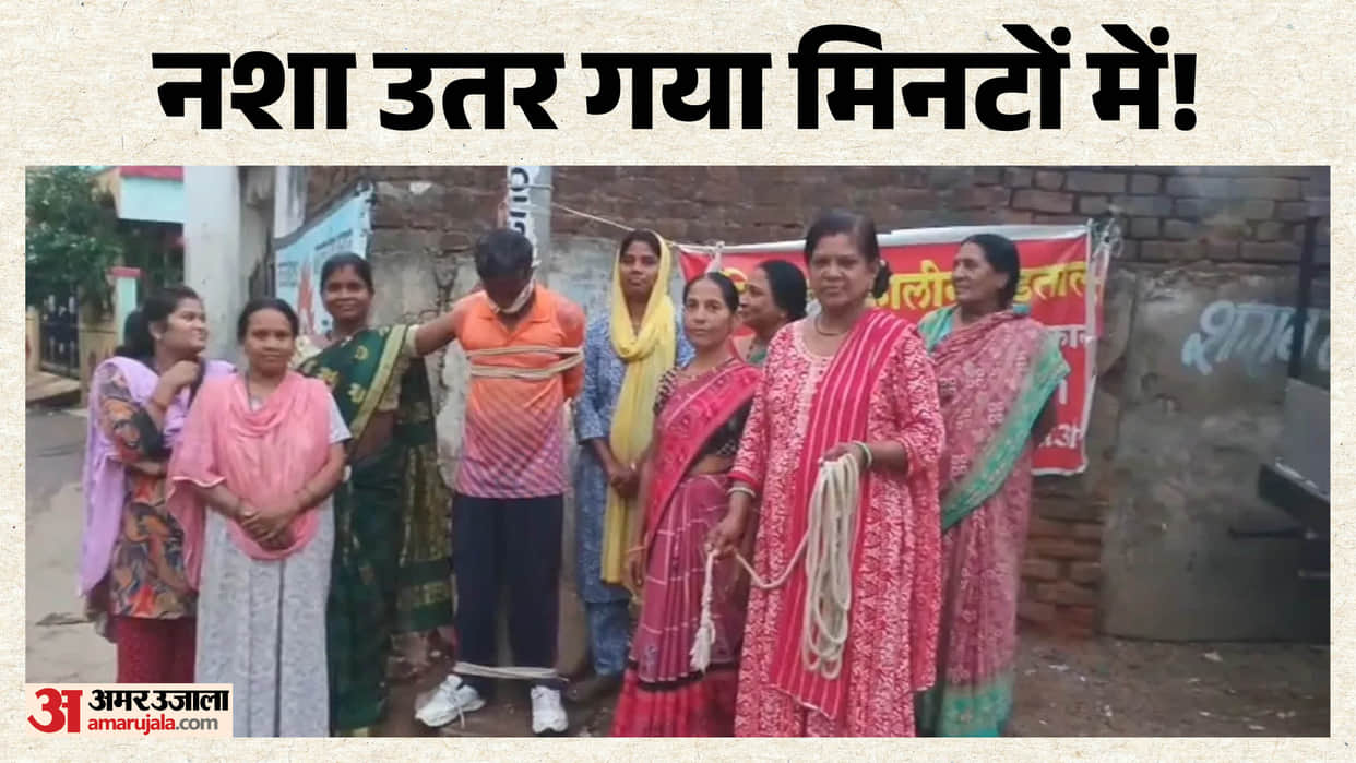 balaghat woman ties drunk husband to electric pole during liquor shop protest viral video