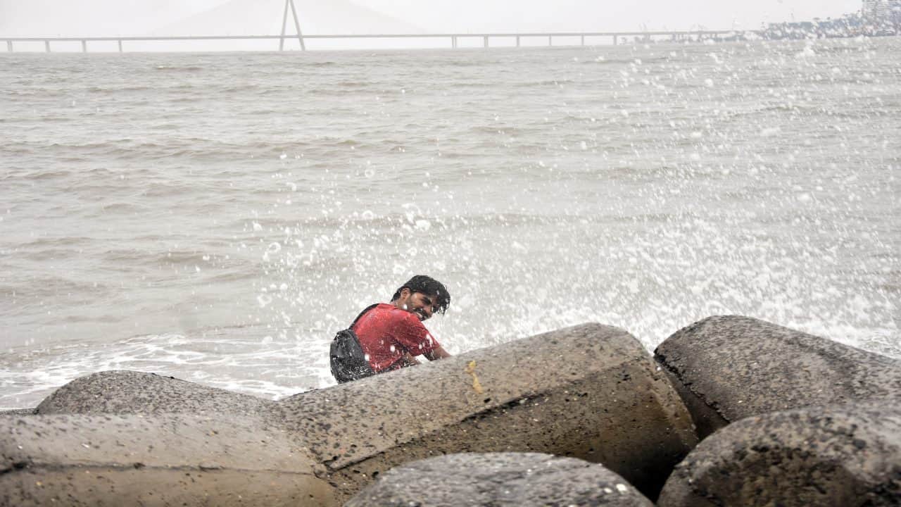 Heavy rainfall disrupts normal life in Mumbai waterlogging in several areas what did the IMD say the alert