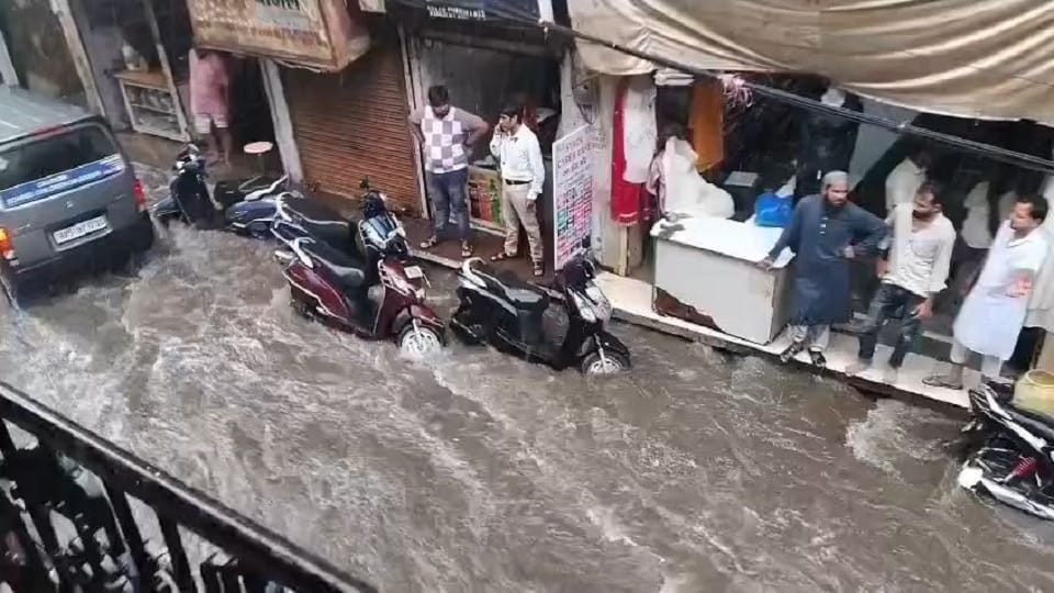 Half-Hour Rain Floods Mathura: Underpasses Submerged Commuters Risk Lives Crossing Railway Tracks