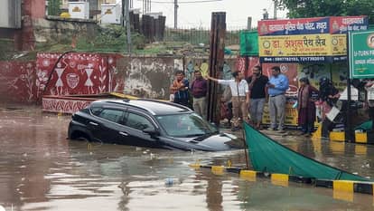 Half-Hour Rain Floods Mathura: Underpasses Submerged Commuters Risk Lives Crossing Railway Tracks
