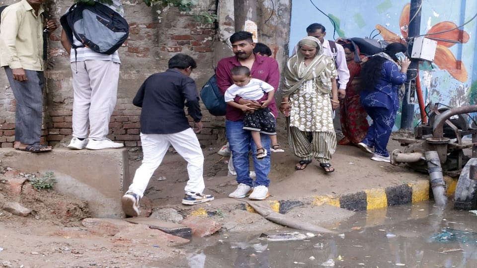 Half-Hour Rain Floods Mathura: Underpasses Submerged Commuters Risk Lives Crossing Railway Tracks