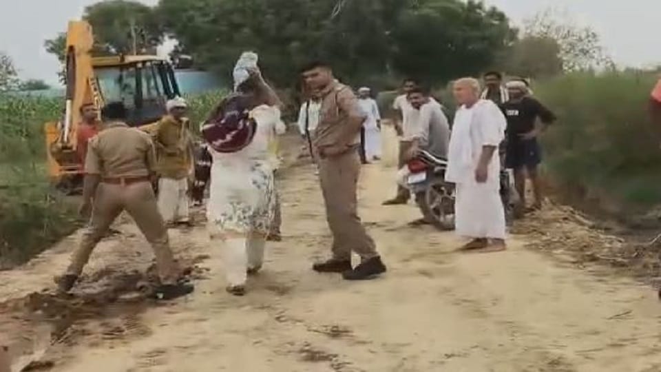 woman poured petrol on herself in front of police amidst dispute over pathway In Mathura