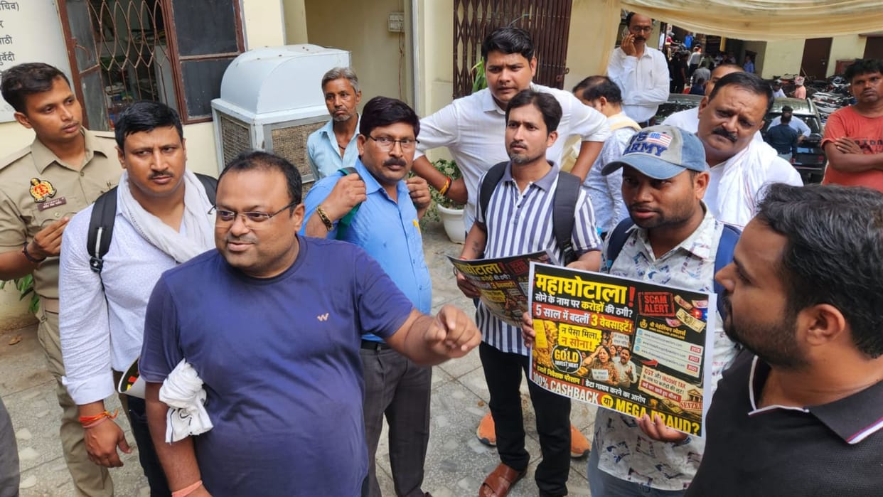 People from Jalaun protest in Varanasi carrying placards alleging massive scam police take action
