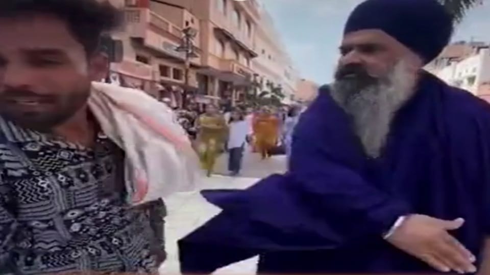 Nihang beats young boy on Heritage Street in Amritsar