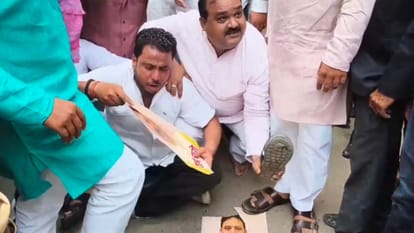 Varanasi SP members upset over Minister State remarks stage protest party headquarters accuse BJP