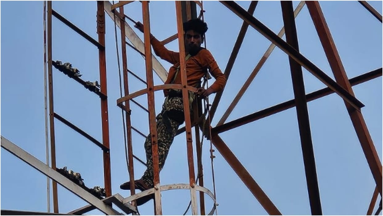 Youth climbs mobile tower for the second time police and technician bring him down
