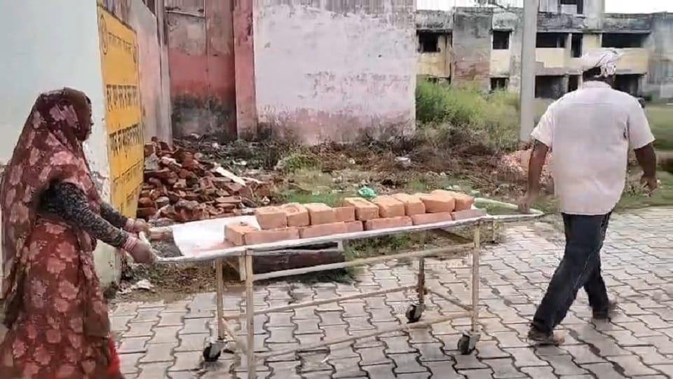 Patient Stretchers Used to Carry Bricks at Ral CHC