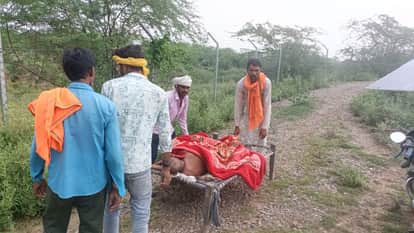 Elderly man carried on cot after venomous insect bite as muddy road blocks ambulance access