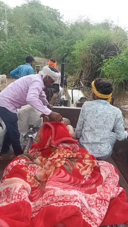 Elderly man carried on cot after venomous insect bite as muddy road blocks ambulance access
