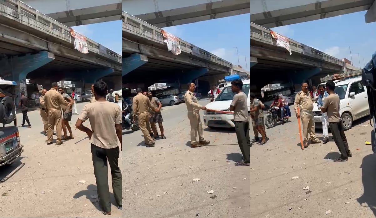 Kanpur Traffic TI aggressive conduct brandishing  baton and hurling abuses in the middle of an intersection