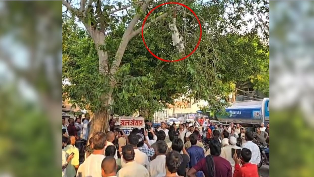 Young man protests by hanging from tree after failing to receive outstanding dues in azamgarh