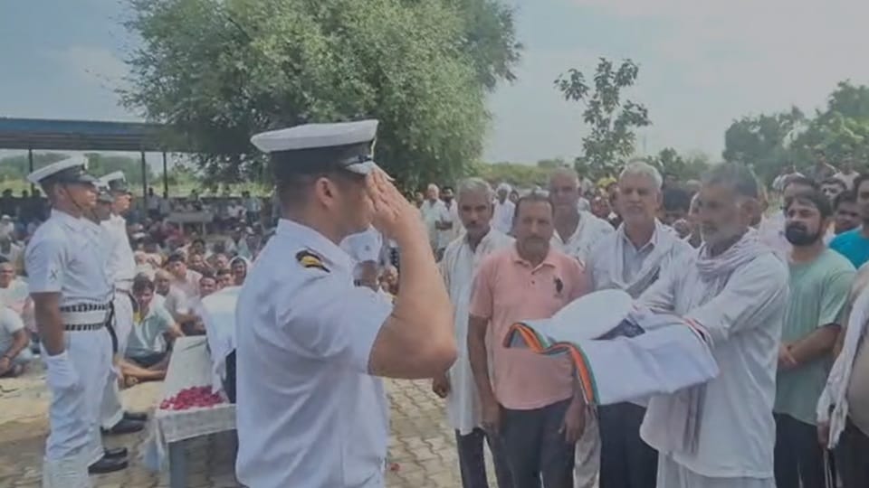 Navy personnel Ravikant was accorded a final farewell with military honors in Kanina Mahendragarh