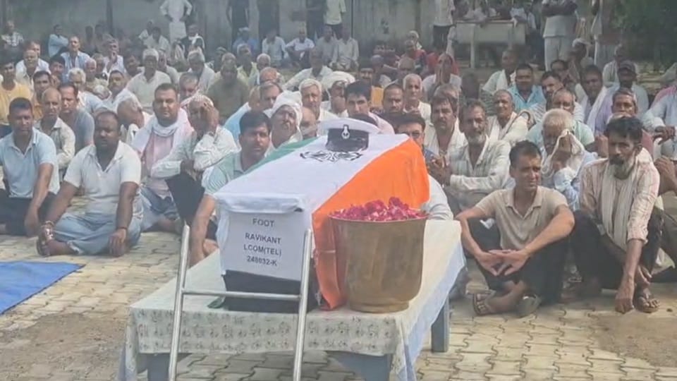Navy personnel Ravikant was accorded a final farewell with military honors in Kanina Mahendragarh