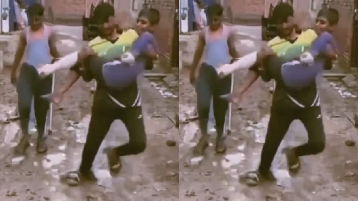 Man Tries to Carry Injured Boy Slips Twice on Muddy Path Viral Video Sparks Reactions