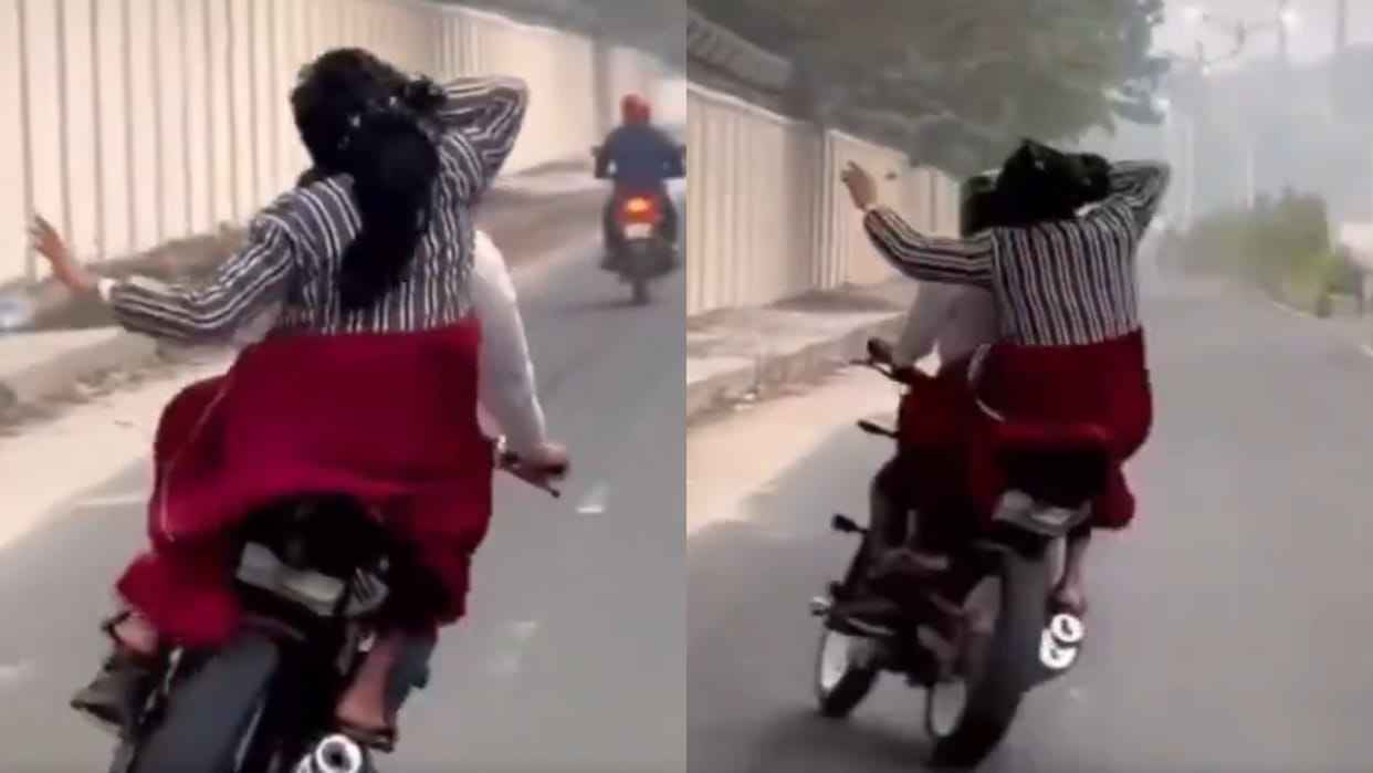 Man performs dangerous zig zag bike stunt with girl on road video goes viral on social media