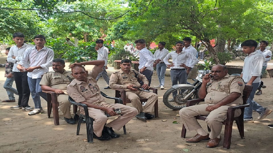 Students protest against the dismantling of the cricket pitch