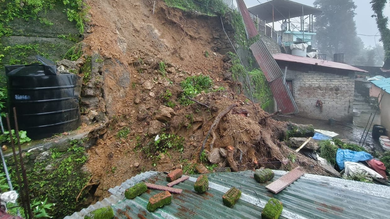 Uttarakhand Mussoorie Trees collapsed onto a house roof following rain traffic disrupted as rivers swelled