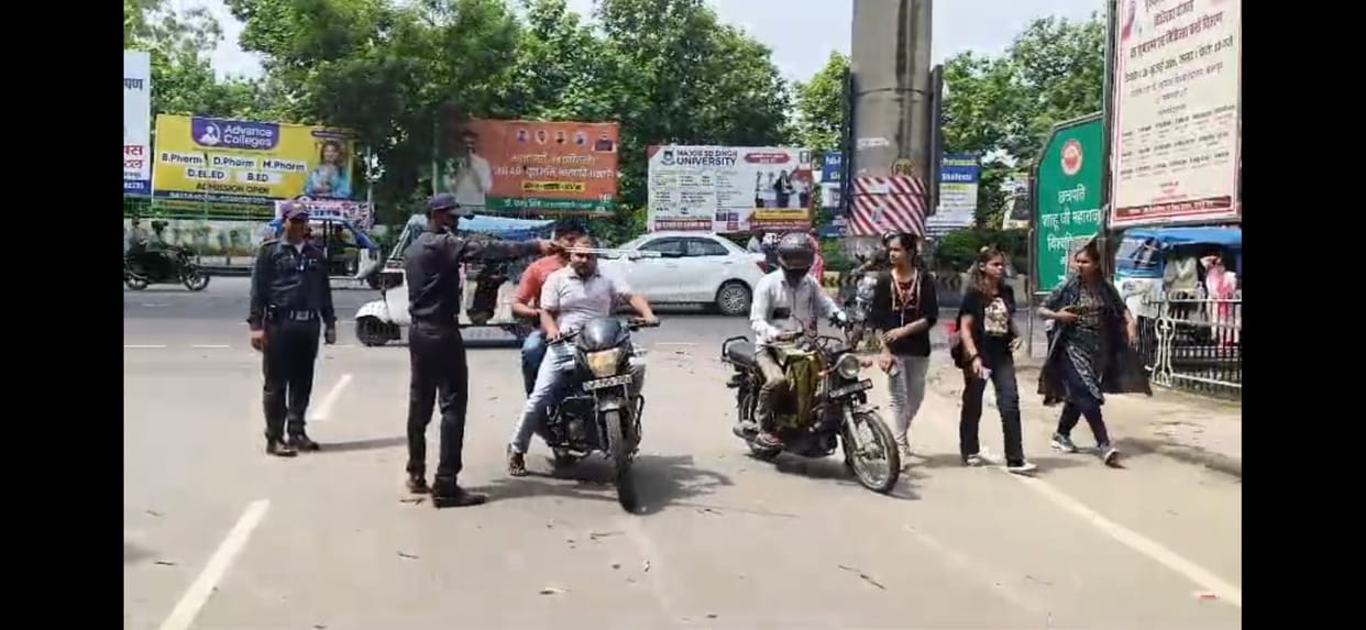 Kanpur Strict No Helmet No Entry at CSJM teachers students and staff without helmets turned away