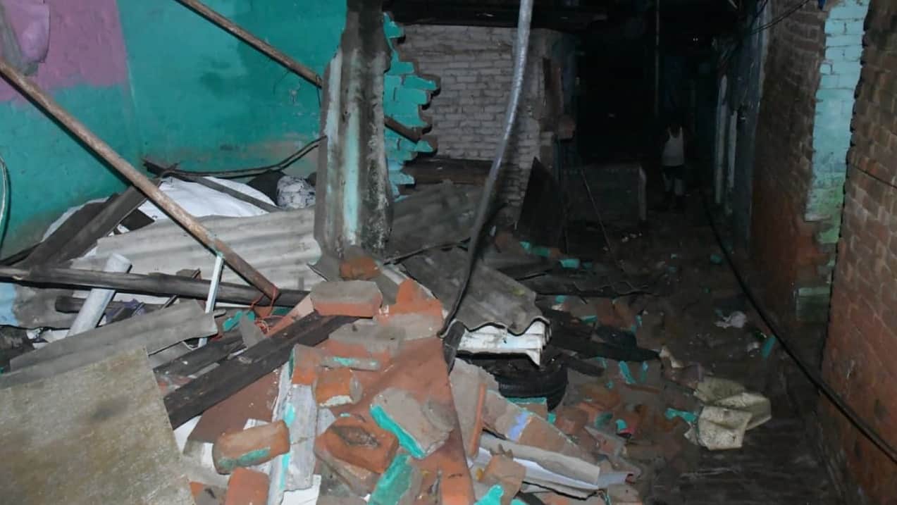 Kanpur Rain and waterlogging in Jajmau Two hours of rain destroy homes waistdeep water collapsing houses