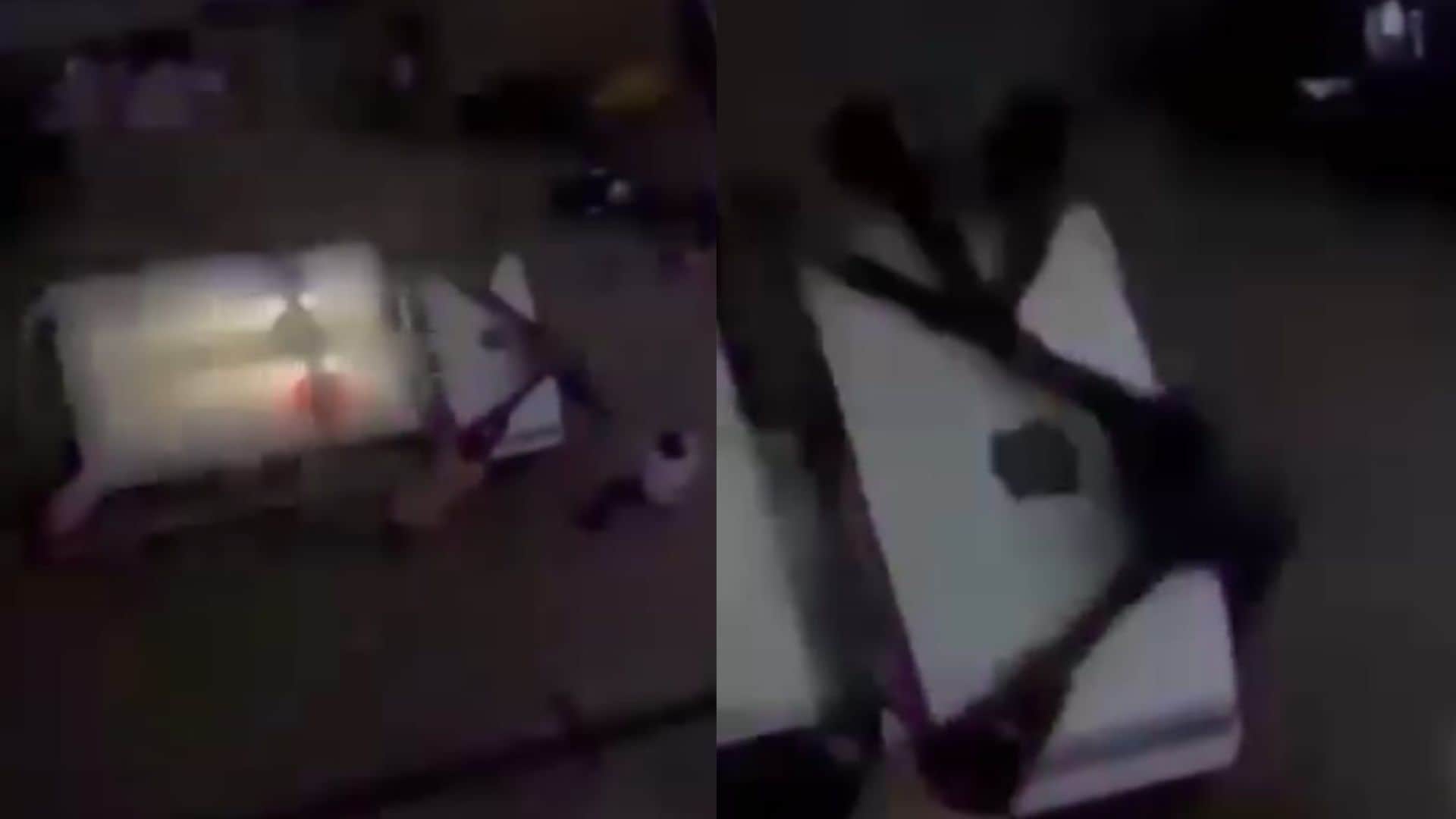 वीडियो में एक युवक को पुलिस वाहन के बोनट पर दबोचे हुए दिखाया