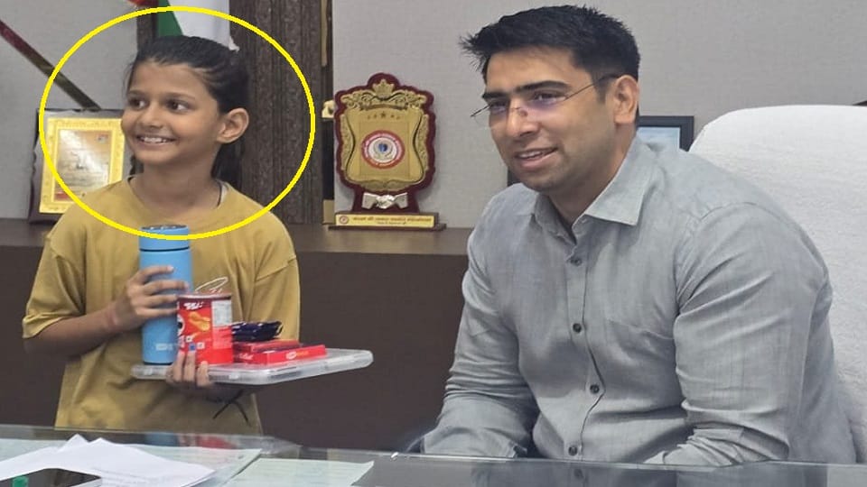Eight-year-old girl and Hathras DM Atul Vats