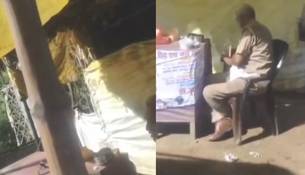 Kanpur police personnel spotted drinking at a three way intersection causing inconvenience to passersby