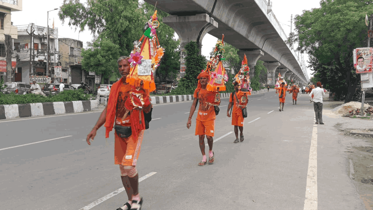 sea of Shiva devotees Delhi-Meerut Road Upper Ganga Canal towpath in Muradnagar photos sawan 2026