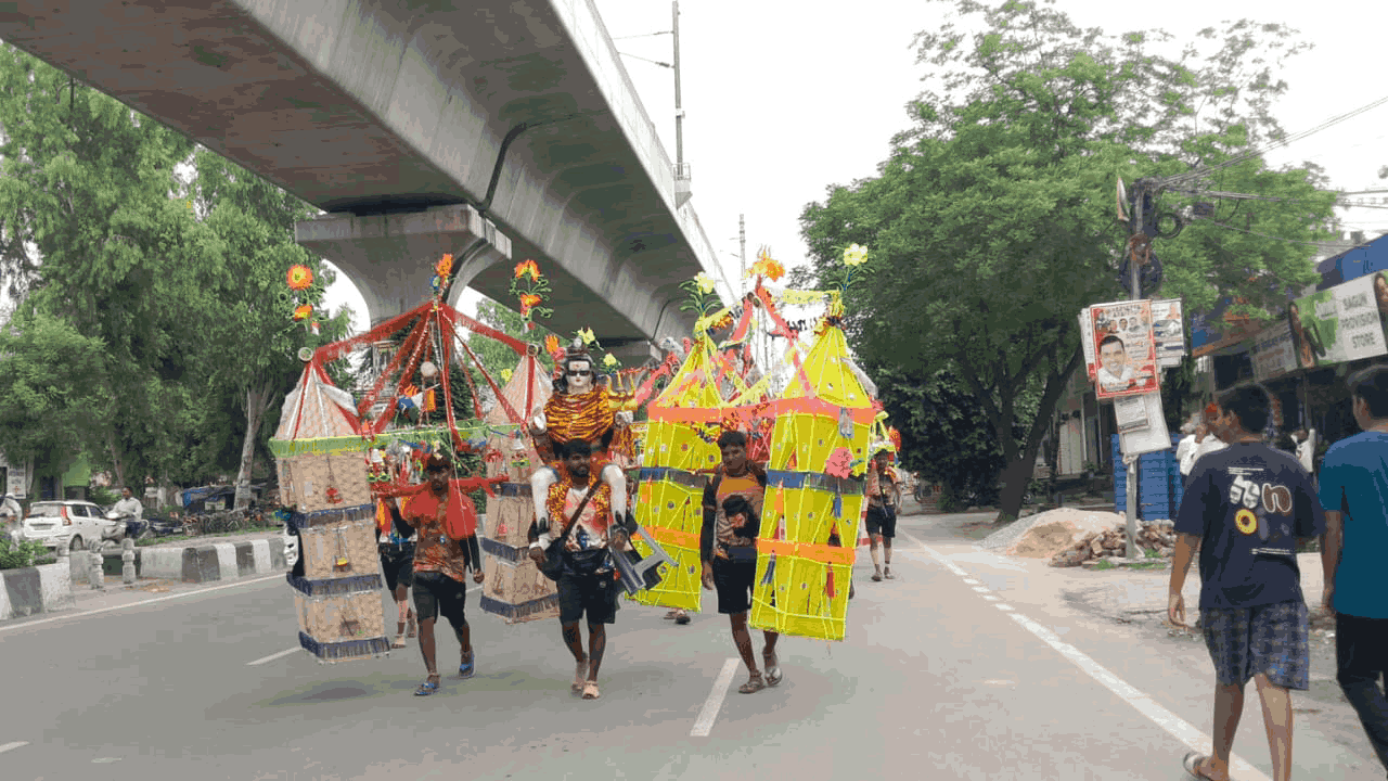 sea of Shiva devotees Delhi-Meerut Road Upper Ganga Canal towpath in Muradnagar photos sawan 2026