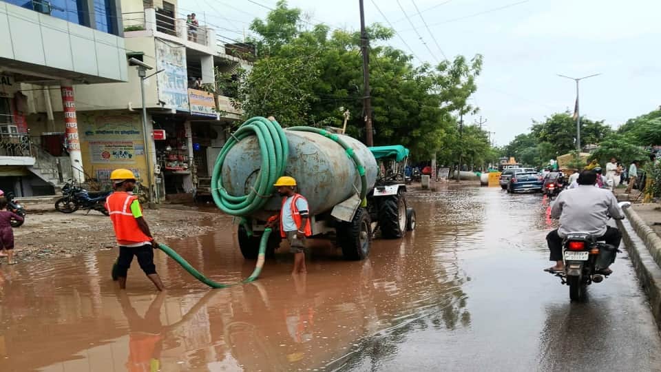 Rain Exposes Civic Gaps: Choked Drains Turn Roads Into Ponds Water Rises to Three Feet