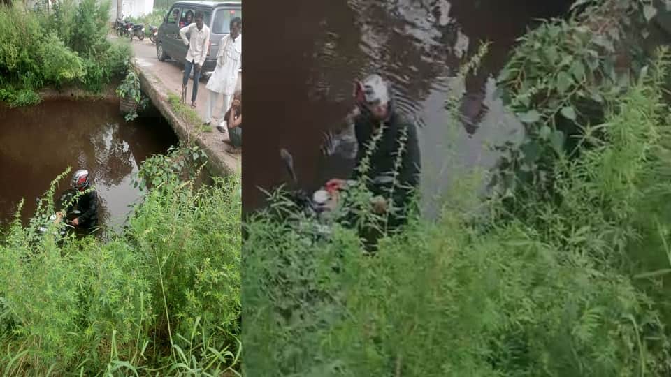 Two Youths Fall into Canal with Bike After Crossing Damaged Bridge in Saiyan