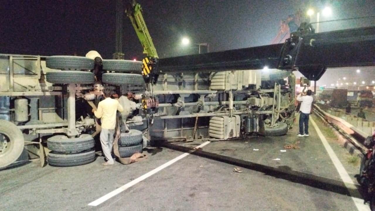container truck runs over two man on bike both killed