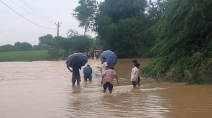 Rain havoc in Mahoba Seeho Nala overflows cutting off six villages villagers risking their lives to cross