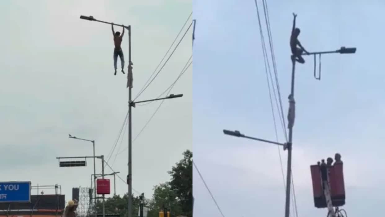Lover Climbs Street Light Pole Rescue Team Uses Hydraulic Crane After Viral Drama