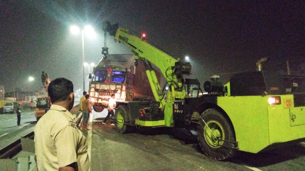 container truck runs over two man on bike both killed