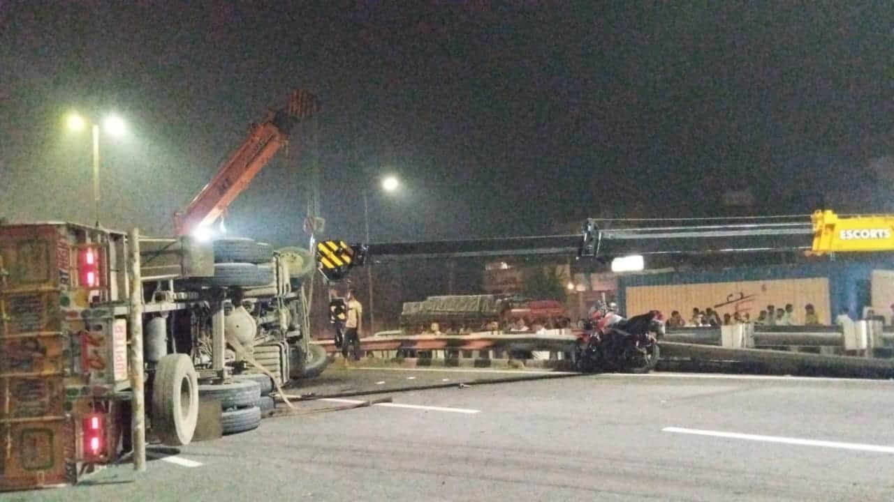 container truck runs over two man on bike both killed