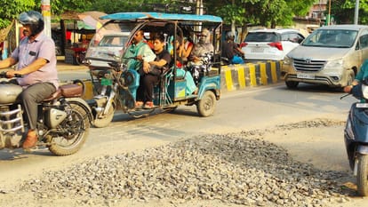 Varanasi Sigra and Chhitaipur road caved Shivpur locals placed stick pothole adding inconvenience