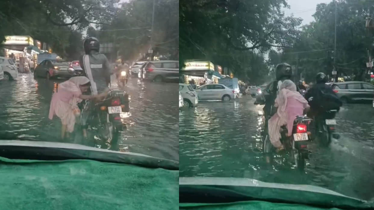 Delhi biker helps elderly woman on waterlogged road video goes viral on internet