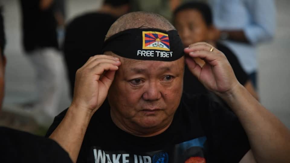 Tibet anguish visible in Chandigarh 200 Tibetans take to streets in black attire Lobga gave his life